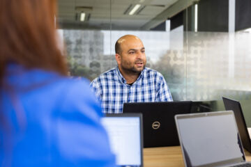 eWorks Capability staff in meeting with a group of people