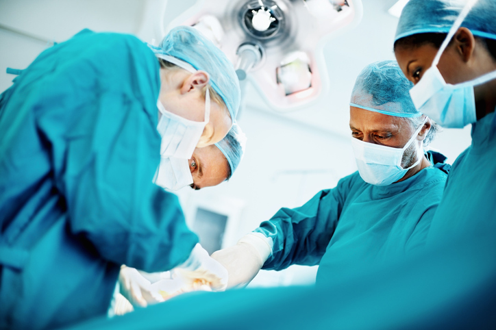 eWorks General Surgeons Australia Case Study with four surgeons in operating theatre