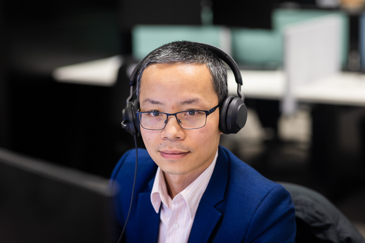 eWorks LMS Client Support with male wearing a phone headset
